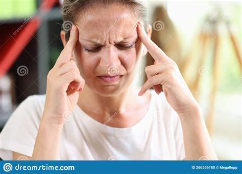 Woman With Headache Holds Her Hands To Her Temples Stock Photo Image