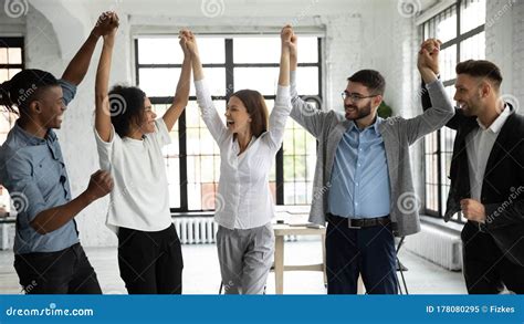 Excited Diverse Business Team Celebrate Hands Up Corporate Victory