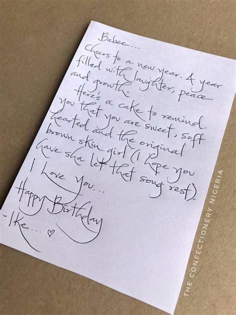 A Handwritten Birthday Card On Top Of A Piece Of Paper