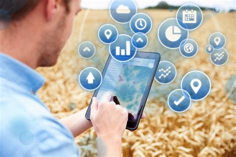 Farmer In Field Accessing Data On Digital Tablet - IPSTAR Broadband