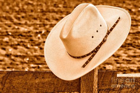 White Cowboy Hat On Fence Sepia Photograph By Olivier Le Queinec