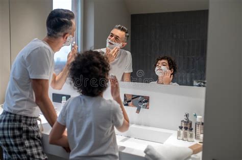 Dad And Son Having Mens Morning Procedures In The Bathroom Stock Photo Image Of Caucasian