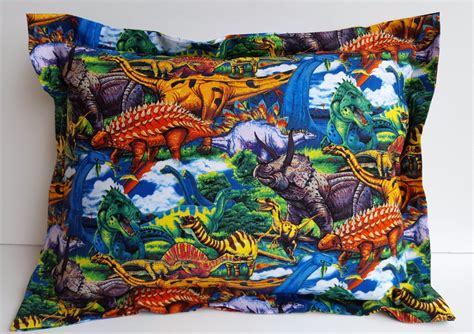 A Colorful Pillow With Dinosaurs On It
