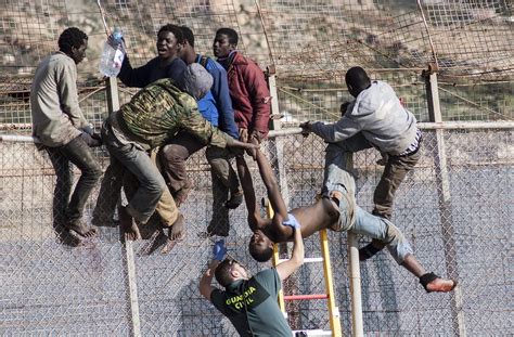 Hundreds of African Migrants Break Through Border Fence To ...