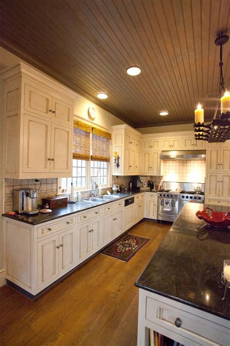 All wood ceilings add a natural touch to any room. Kitchen | Cream cabinets | wood ceiling | Crittersitters ...