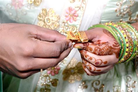 An Indian Bride And Groom Their Shows Engagement Rings During A Hindu