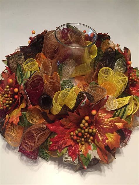 Deco mesh comes in a ton of different colors and is available at walmart or craft stores like hobby lobby or. Fall Multi Color Lg. Mesh Centerpiece | Deco mesh wreaths ...