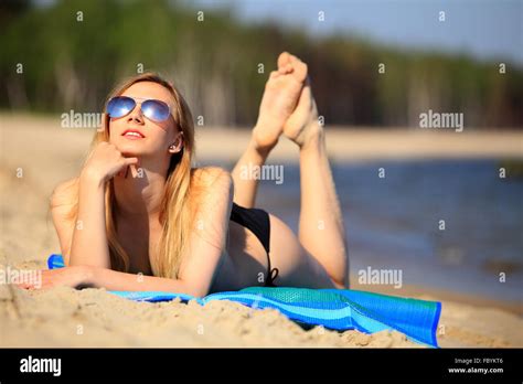 Smiling Beautiful Woman Sunbathing On A Beach Stock Photo Alamy