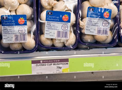 Pre Packed Mushrooms On A Supermarket Shelf Stock Photo Alamy