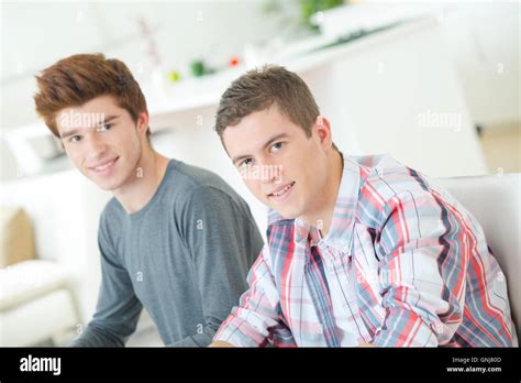 Two Guys Chilling On The Sofa Stock Photo Alamy