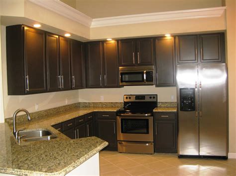 White and a rich, dark gray are my favorite colors to use in a kitchen. Array of color inc: Paint Kitchen Cabinets