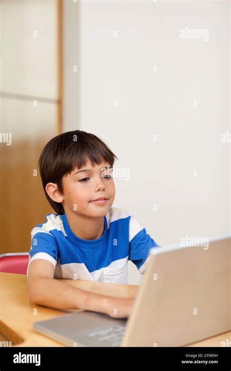 Boy Playing Computer Games On The Laptop Stock Photo Alamy