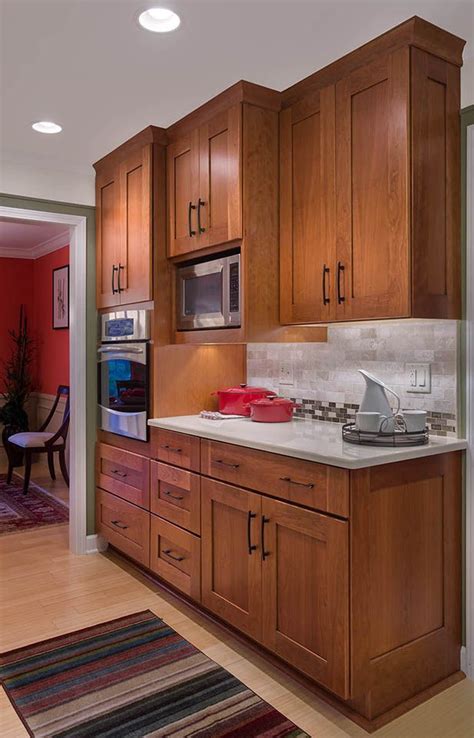 • traditional paneled cabinets give your kitchen a tailored look • cabinets ship next day. the red | Brown kitchen cabinets, Cherry wood kitchen ...