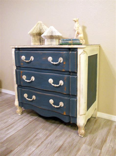 This small white dresser has an attractively simple design to bring a touch of elegance to any bedroom nursery. Shabby Chic Blue and White Dresser by ABitOWhimsy on Etsy, $150.00 | Shabby chic, White dresser