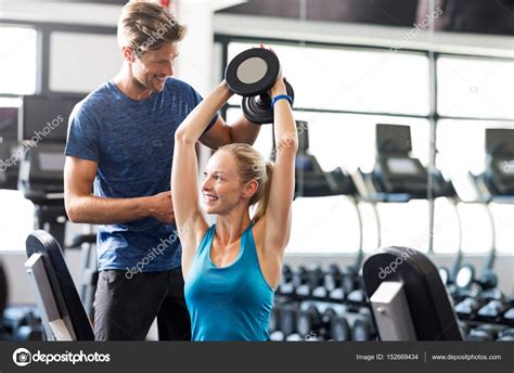 Woman With Personal Trainer Stock Photo By ©ridofranz 152669434