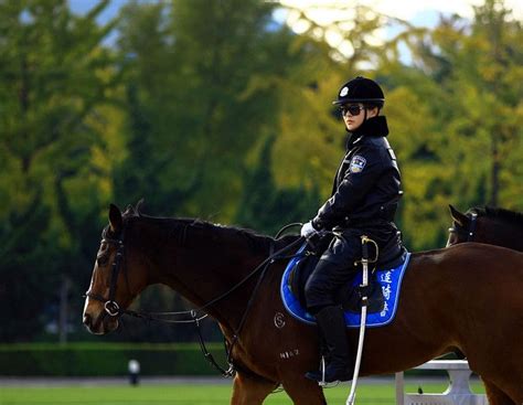 Dalians Mounted Policewoman In Full Leather Uniform Riding Helmets