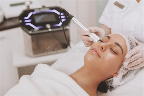 Lovely Young Woman Visiting Cosmetologist At Beauty Clinic Stock Image