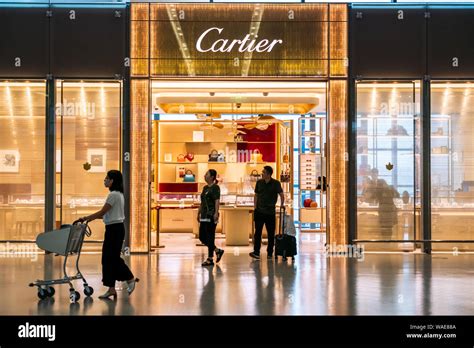 Pedestrians Walk Past The French Luxury Goods Conglomerate Cartier