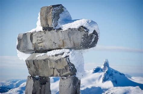 Inukshuk On The Peak On Whistler Mountain With Black Tusk In The