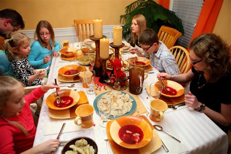 Enjoying xmas meal feast in decorated room. A Polish Christmas Eve Dinner - Global Volunteers Service Programs