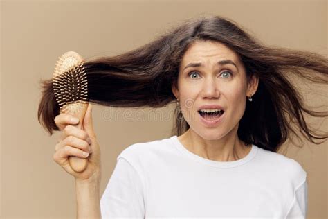 Beautiful Attractive Middle Aged Brunette Woman Combing Her Long Hair