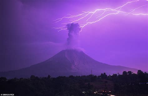 Lightning Bolt Strikes Above Erupting Volcano Turning Sky Purple Daily Mail Online