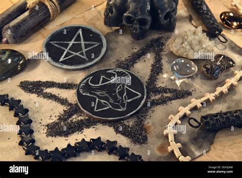 Scary Symbols Of Devil And Pentagram With Black Candles And Crystals On