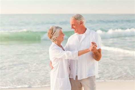 Elderly Couple Dancing On The Beach Stock Image Image Of Healthy