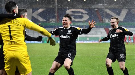 Wolfsburg beat holstein kiel to stay in bundesliga. Holders Bayern Munich knocked out of German Cup on ...