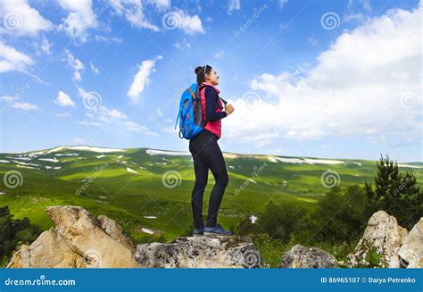 Hiker With Backpack On Top Of Mountain And Enjoying Valley View Stock