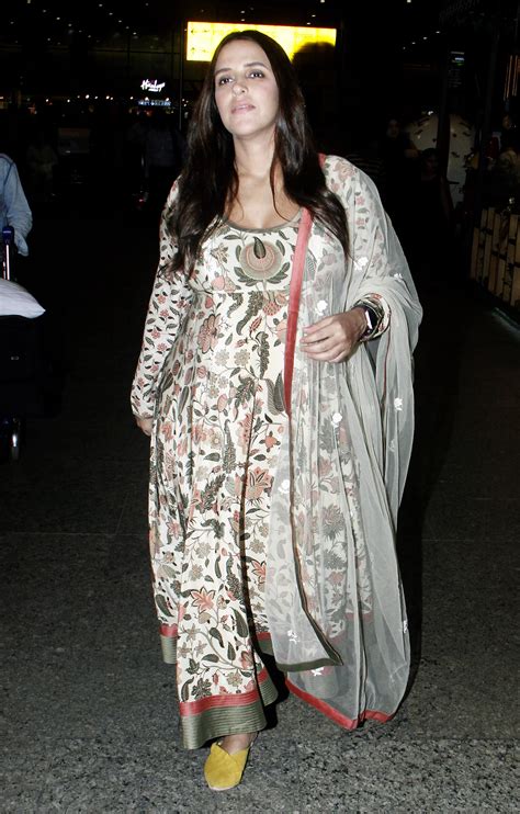 photo gallery mom to be neha dhupia looks gorgeous in a floral suit news zee news