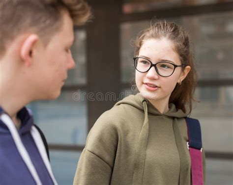 Portrait Of Two Teenage Friends Chatting Outdoors Stock Image Image