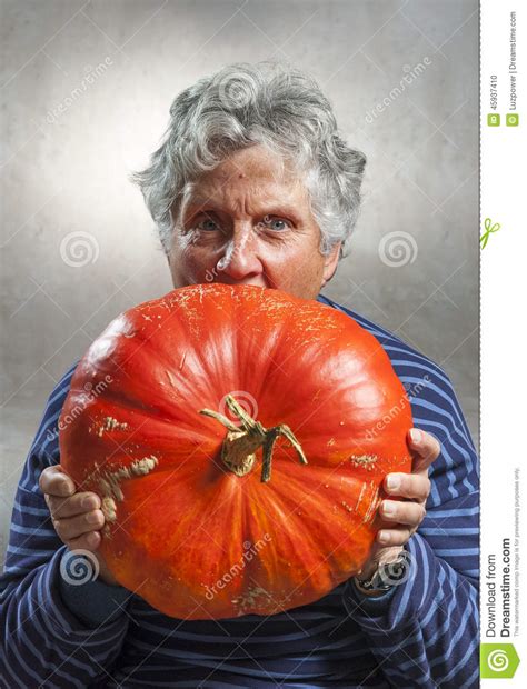 Scary Old Woman Eating A Big Ripe Pumpkin Halloween Theme