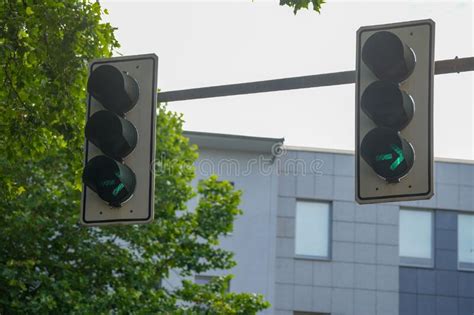 Traffic Lights Showing A Green Light For Cars Turning Right The Street