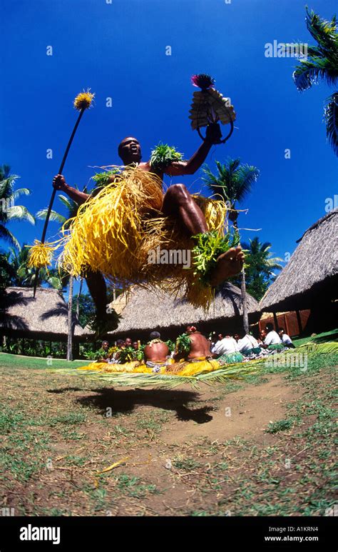 Fijian Warrior Leaps In The Air During Meke Dance Stock Photo Alamy