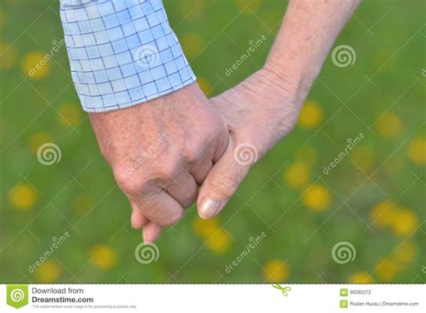 Senior Couple Holding Hands Stock Photo Image Of Holding Daytime