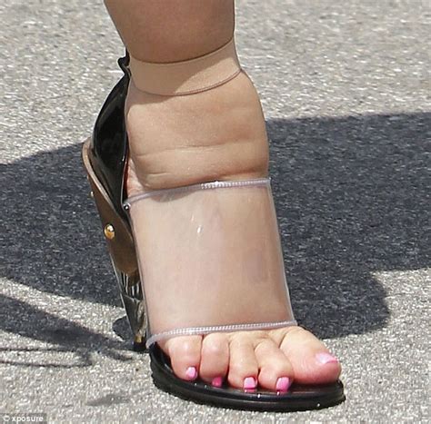 Kim Kardashians Swollen Feet Are Severely Pinched As She Squeezes Them
