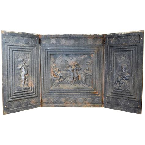 It had about an inch of gloss paint on, so we removed it from the wall and had it dipped to remove the paint. Cast Iron Decorative Fireplace Back, circa 1900 at 1stdibs