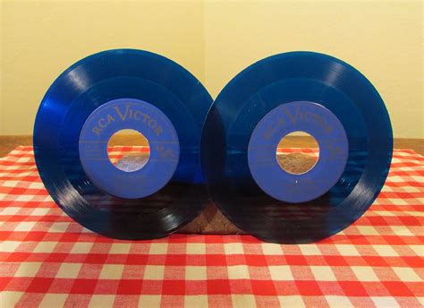Blue Vinyl Records Set Of Two 45 Rpm Records In Dust Jackets By