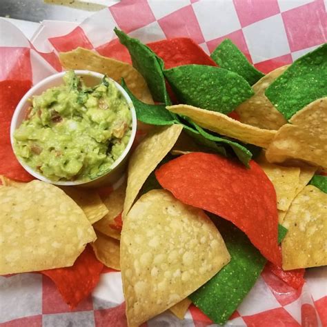 Then top with pico de gallo, cilantro, and cotija cheese with some lime wedges, guacamole and hot sauce on the side. Tortilla Chips with Guacamole - Chiapaneca Food