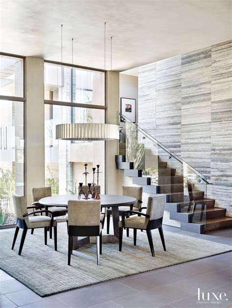 Contemporary Neutral Dining Room With Dynamic Staircase Luxe