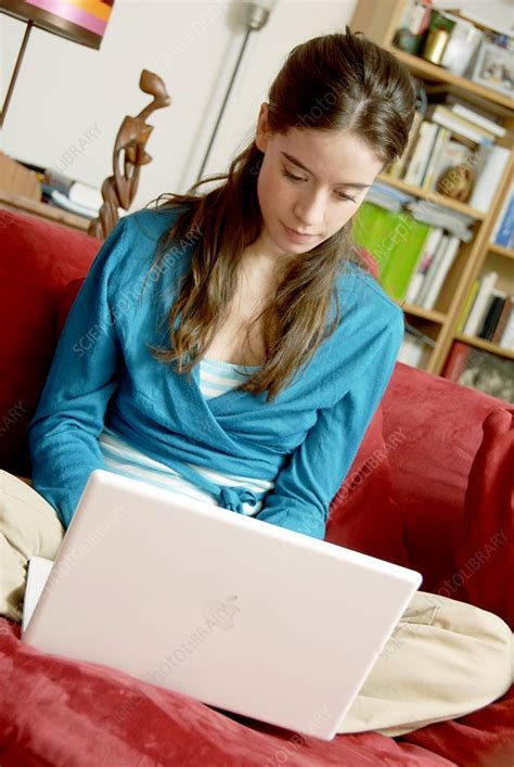Woman using a laptop computer - Stock Image - C004/4178 - Science Photo Library