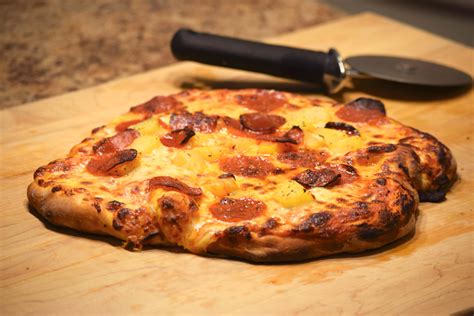 Place a pizza stone into oven, dust it with a little flour, and preheat oven to 500 degrees f (260 degrees c). New York Style Pizza Dough - Indiana Mommy - Cooking From ...