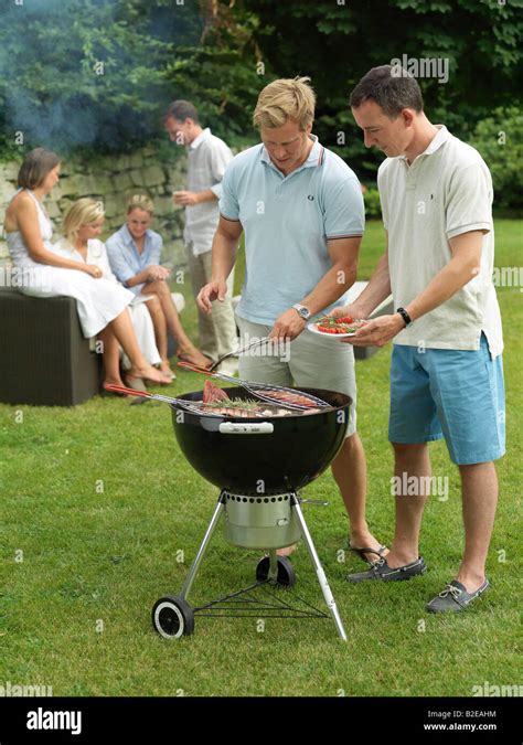 Group Of People Having Barbecue Stock Photo Alamy