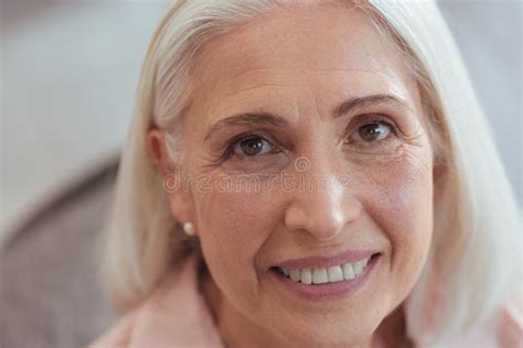 Close Up Of An Open Minded Aged Smiling Woman Stock Image Image Of