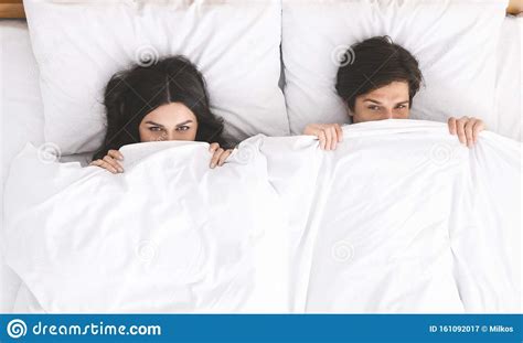 Playful Couple Hiding Under White Blanket In Bed Stock Image Image Of Panorama Hiding 161092017