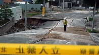 Japan earthquake toll up to 18 as rescuers dig through landslides