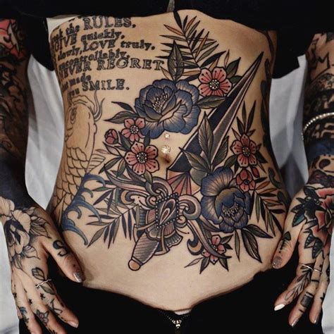 Male upper stomach tattoo of bird flying with three arrows in black ink side stomach tattoos of woman Stomach Tattoos Women Full + Stomach Tattoos Women ...