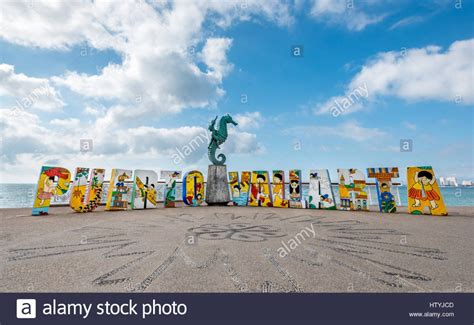 The Colorful Puerto Vallarta Sign On The Malecon With “caballero Del