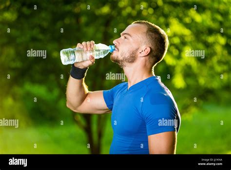 Athletic Mature Man Drinking Water From A Bottle Stock Photo Alamy